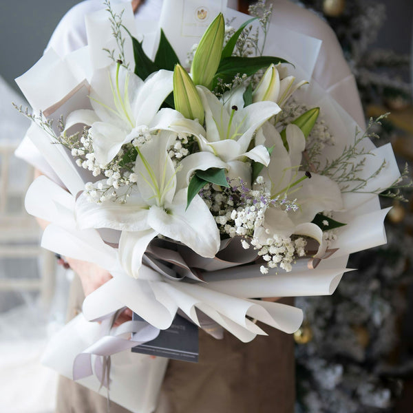 Fresh white lily with baby breath flower bouquet